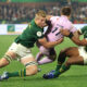 PRETORIA, SOUTH AFRICA - JULY 11: Jamie Dobie of Scotland is tackled by Pieter-Steph du Toit (L) and Damian Willemse during the 2026 Nations Championship match between South Africa and Scotland at Loftus Versfeld Stadium on July 11, 2026 in Pretoria, South Africa. (Photo by David Rogers/Getty Images)
