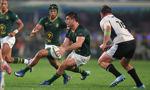 Paul de Villiers of South Africa runs with the ball while under pressure from Ryan Elias of Wales during the 2026 Nations Championship match between South Africa and Wales at Kings Park Stadium on July 18, 2026 in Durban, South Africa. (Photo by David Rogers/Getty Images)