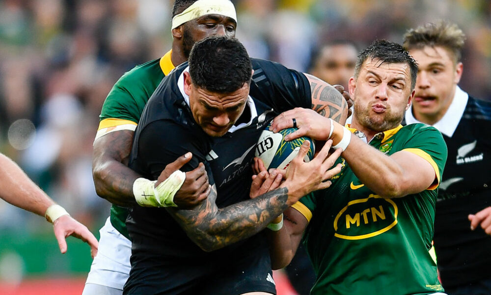 Codie Taylor of the All Blacks tackled by Handre Pollard and Siya Kolisi (captain) of the Springboks during the Castle Lager Rugby Championship match between South Africa and New Zealand at DHL Stadium on September 07, 2024 in Cape Town, South Africa. (Photo by Ashley Vlotman/Gallo Images/Getty Images)