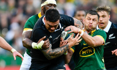 Codie Taylor of the All Blacks tackled by Handre Pollard and Siya Kolisi (captain) of the Springboks during the Castle Lager Rugby Championship match between South Africa and New Zealand at DHL Stadium on September 07, 2024 in Cape Town, South Africa. (Photo by Ashley Vlotman/Gallo Images/Getty Images)