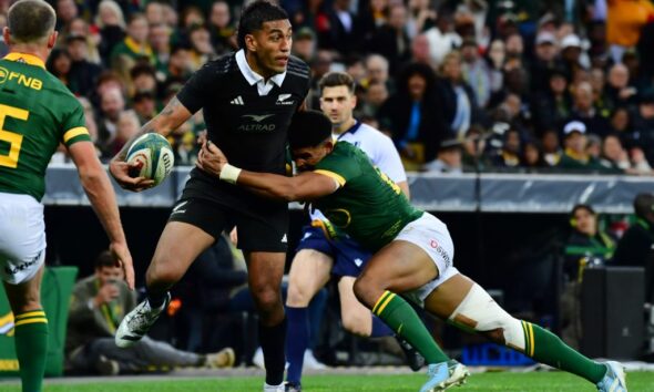 Rieko Ioane of New Zealand tackled by Sacha Feinberg-Mngomezulu of South Africa during the Castle Lager Rugby Championship match between South Africa and New Zealand at DHL Stadium on September 07, 2024 in Cape Town, South Africa. (Photo by Grant Pitcher/Gallo Images)