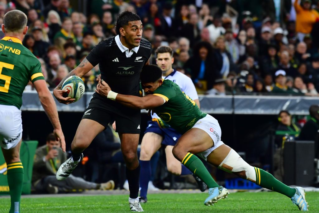 Rieko Ioane of New Zealand tackled by Sacha Feinberg-Mngomezulu of South Africa during the Castle Lager Rugby Championship match between South Africa and New Zealand at DHL Stadium on September 07, 2024 in Cape Town, South Africa. (Photo by Grant Pitcher/Gallo Images)